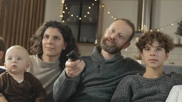 Family enjoying television together in their living room