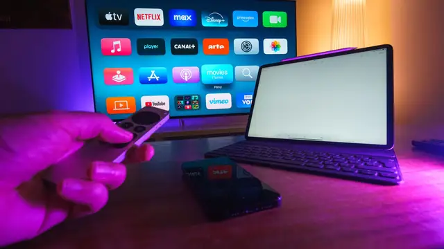 Apple TV interface displayed in a realistic home streaming setup