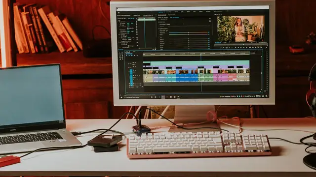 Desktop computer and laptop in a modern video workspace