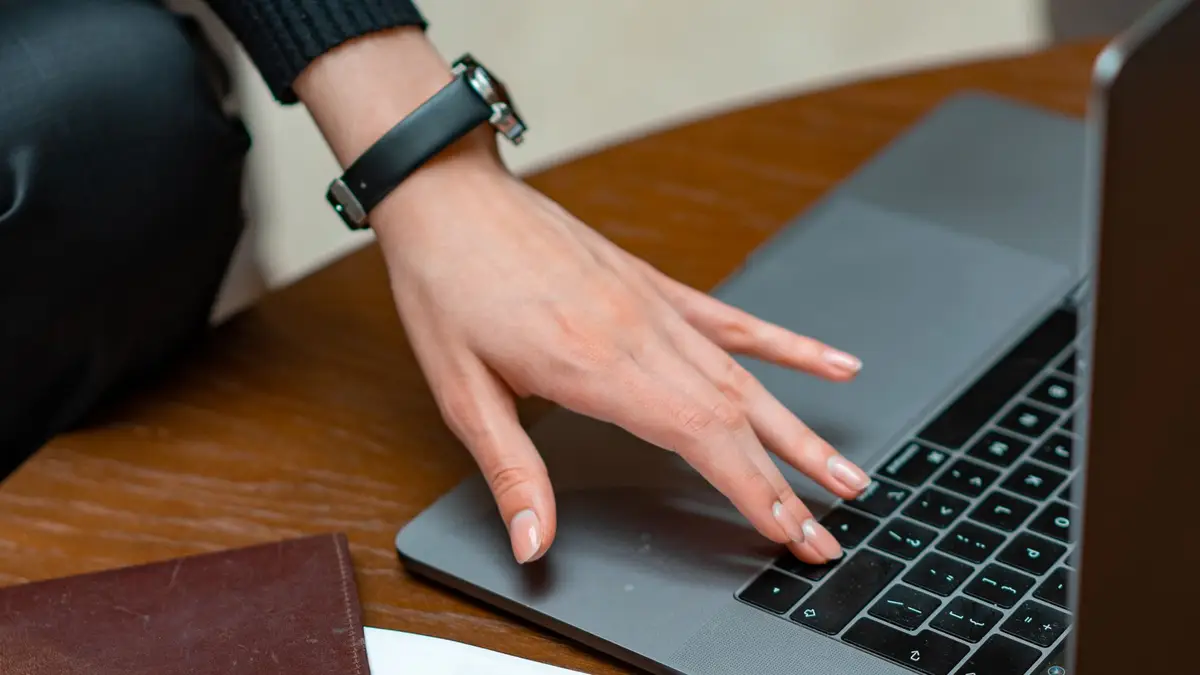 Legal documents and a laptop being reviewed at a desk